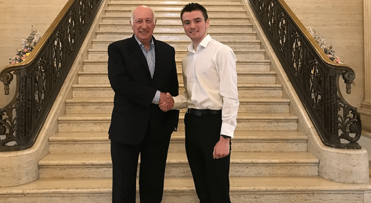 Robin Newton shaking hands with Jack Freedman